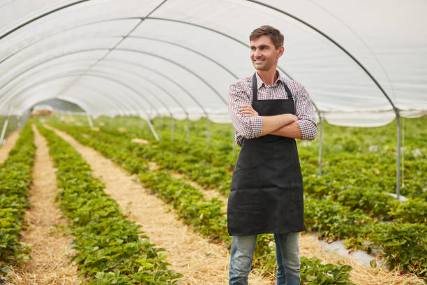 istock Confident small business owner in greenhouse 1475820329