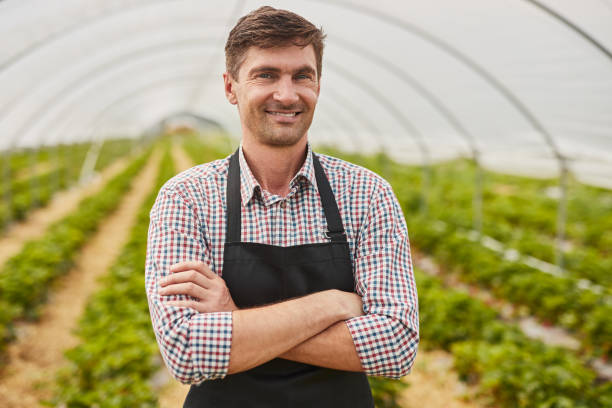 istock Confident male farmer in hothouse 1475820380