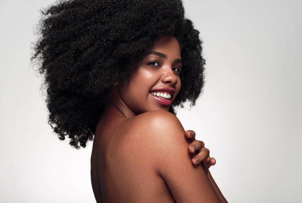 istock Cheerful black woman touching bare shoulder 1475825146