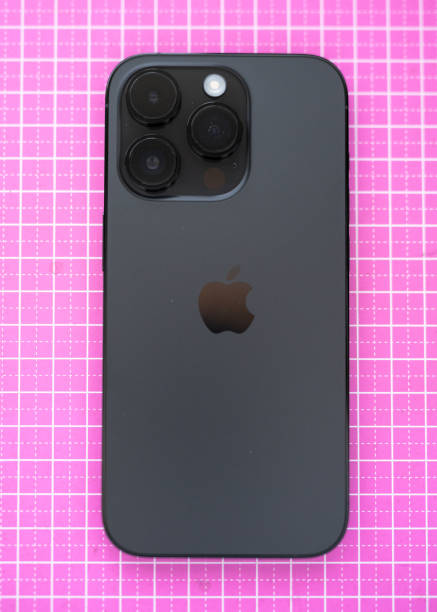 Cape Town, South Africa - March 24, 2023:  iPhone 14 Pro in Space Black colour in box on pink background