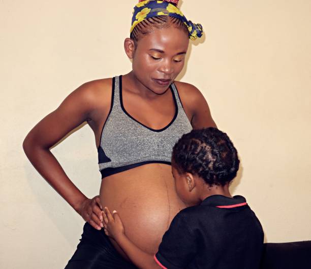 istock black pregnant woman affectionate with her son 1475831776