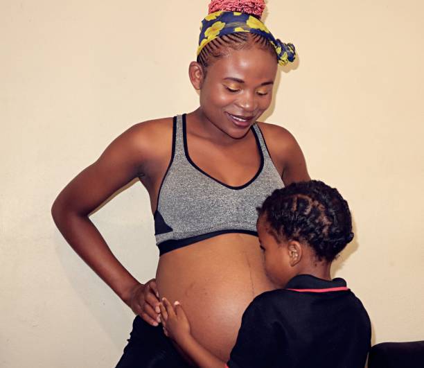 istock black pregnant woman affectionate with her son 1475831787