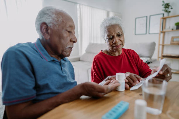 istock Senior couple taking medication at home 1475831946