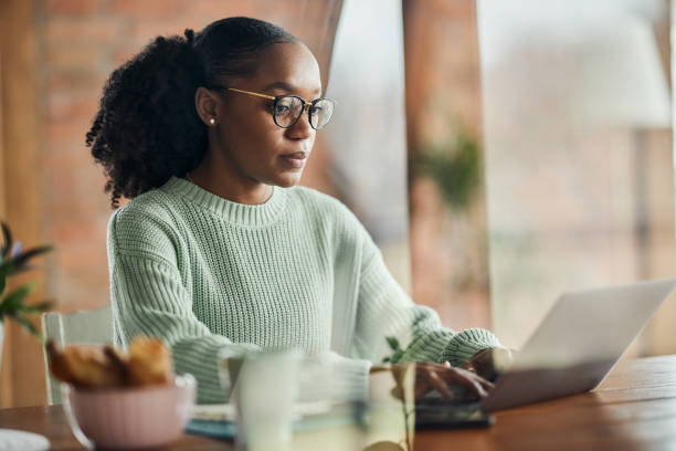 istock African American graphic designer working on a computer at casual office. 1475833076