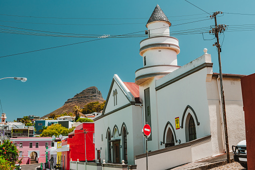 The Bo-Kaap is an area of Cape Town, South Africa formerly known as the Malay Quarter. It is a former racially segregated area, situated on the slopes of Signal Hill above the city centre and is a historical centre of Cape Malay culture in Cape Town. The Nurul Islam Mosque, established in 1844, is located in the area.\n\nBo-Kaap is known for its brightly coloured homes and cobblestoned streets.