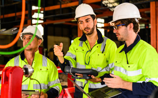 istock Group of professional mechanical engineer team checking and repairing engine 1475834974