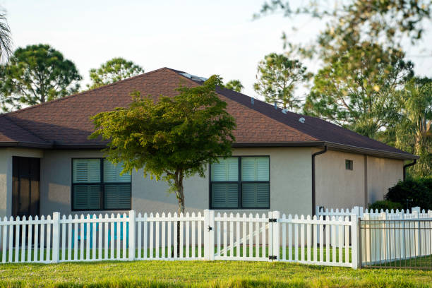istock White plastic fence for back yard protection and privacy 1475836938
