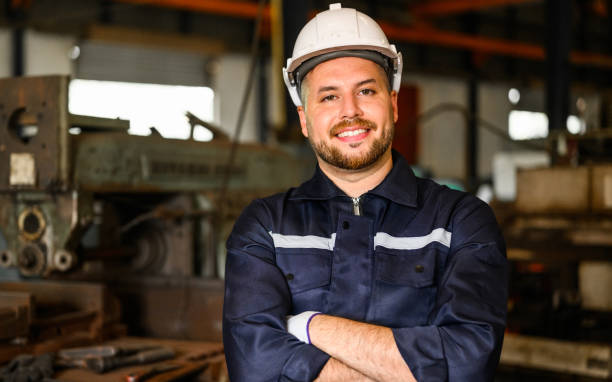 istock Smiling portrait of mechanical technician checking and inspecting machine 1475837287