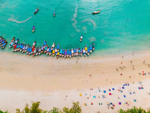 Scenic directly above aerial view of long tails boats on Railey beach in  Krabi Province, Thailand