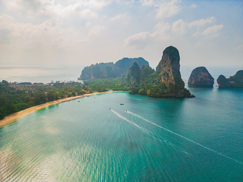 Scenic aerial view of speedboats near an island in Andaman sea