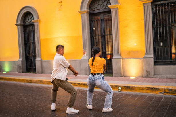 istock Young friends dancing together outdoors 1475846650