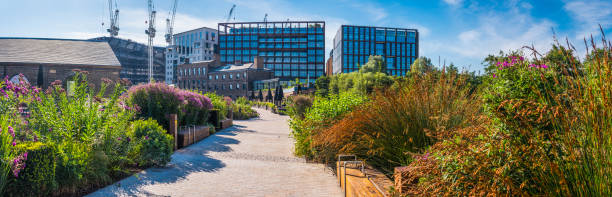 Panoramic view across the elevated park and walkway in the redeveloped Coal Drop Yard in King’s Cross, London, UK.