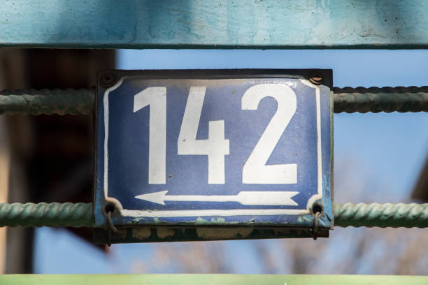 istock Weathered enameled plate number 142 1475850173