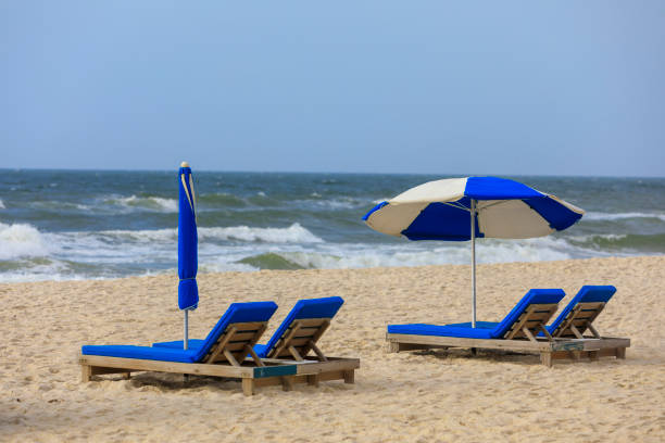 istock Blue and white lounge chairs on the beach 1475855067