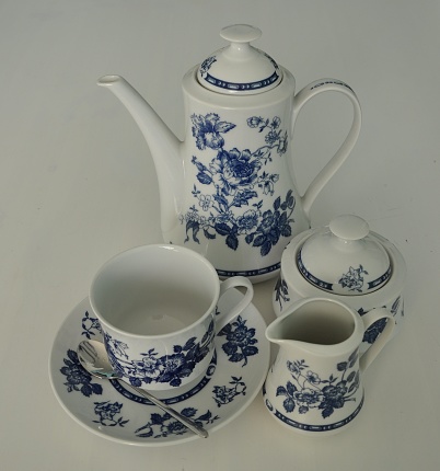 White antique porcelain teapot isolated on white background