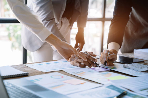 istock Businessmen team or financial data analysts working with tablets and laptop computers and data graphs together. Plan to analyzing projects. 1475864388