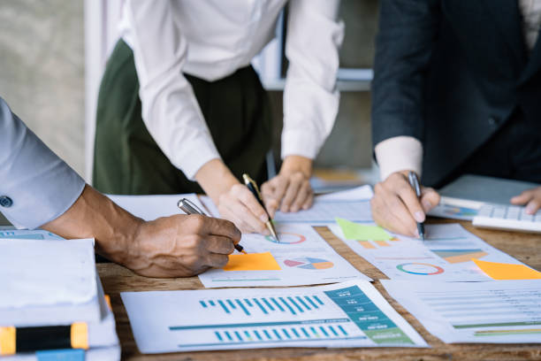istock Businessmen team or financial data analysts working with tablets and laptop computers and data graphs together. Plan to analyzing projects. 1475864401