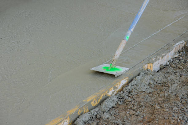 istock A construction company employee forms corners on a cement floor using a stainless steel edger 1475864408