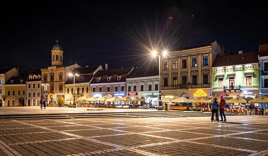 Brasov, Romania. March 15, 2023: Old town Brasov in Romania at night in town square.