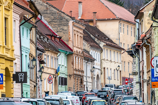 Brasov, Romania. March 15, 2023: Busy road through old town Brasov in Romania