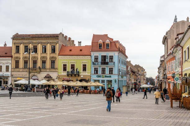 Brasov, Romania. March 15, 2023: Old town Brasov in Romania, people in the town square