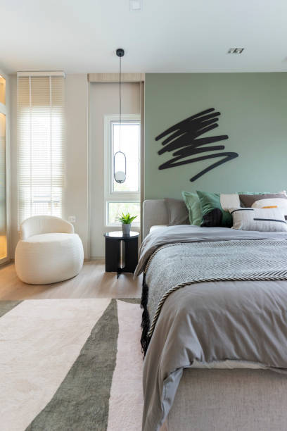 istock Modern bedroom interior with green wall and wall art. 1475864719