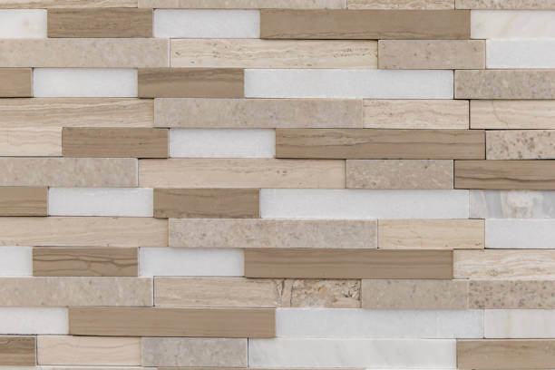 istock Brown, beige and white accent tile for backsplash, kitchen, shower or bathroom walls made of stone 1475867382