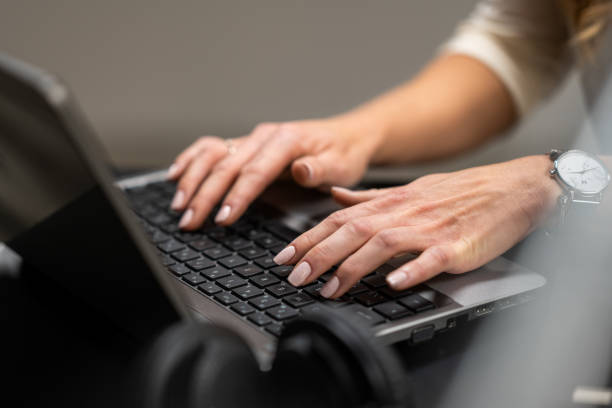 istock Woman arms typing on laptop keyboard 1475871831