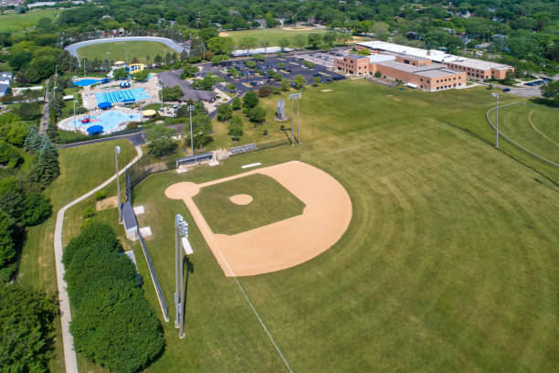 istock School with baseball diamond and public swimming pool 1475874521