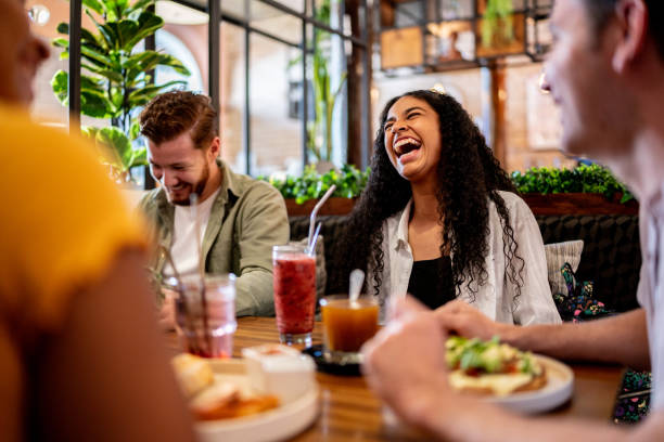 istock Happy friends talking at a bar 1475876763