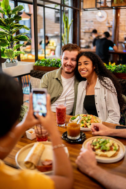 istock Couple posing posing for a photo on a restaurant 1475878987