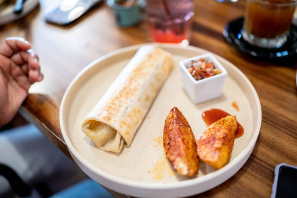 Meat shawarma on a cutting board. Burritos with meat.