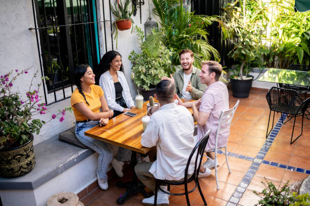 istock Friends talking sitting at a coffee shop table 1475880327