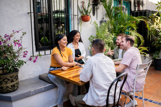 istock Friends talking sitting at a coffee shop table 1475880330
