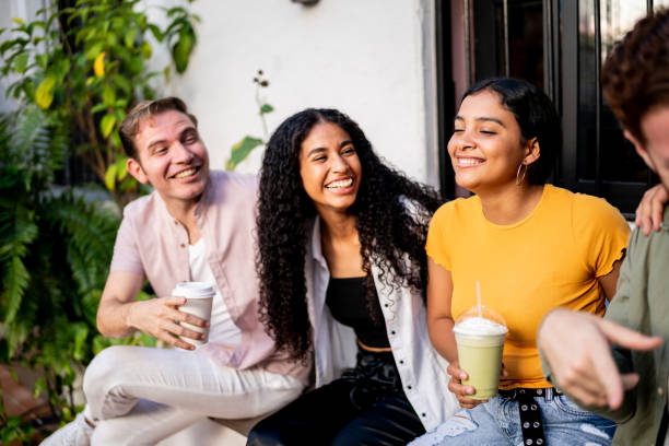istock Happy friends talking at home 1475881627