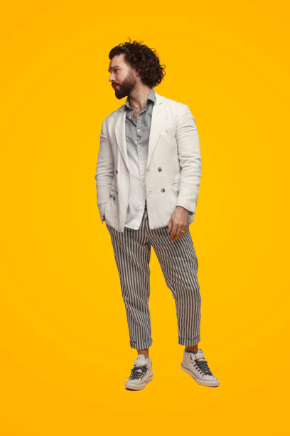 istock Stylish man in trendy outfit in bright studio 1475881661