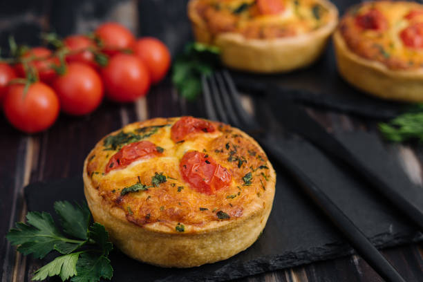istock Cheddar cheese and spring onion omelette tarts served on wooden board 1475881679