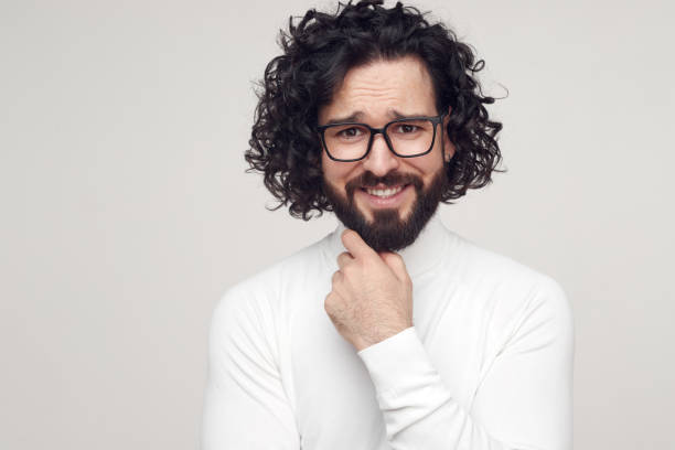 istock Happy bearded man with curly hair in studio 1475881728