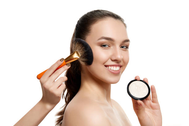 istock Cheerful adorable young with bared shoulders making up over white background. Closeup. Beauty, fashion, skincare, emotions, ad 1475883849