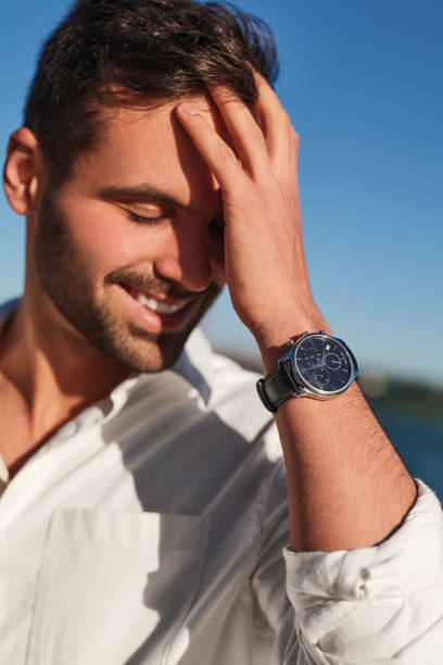 istock Happy man touching dark hair 1475885265
