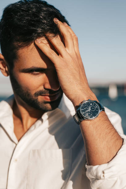Man touching hair and looking away