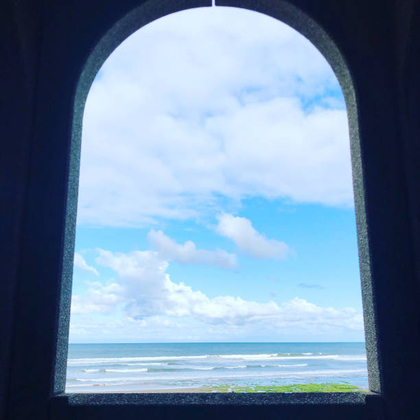 istock Coastline through an arch Scarborough 1475888305