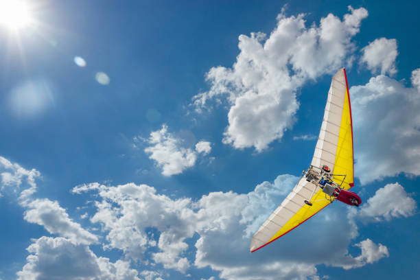 istock Motoplane with a cradle or motoplane in a clear blue sky 1475890961