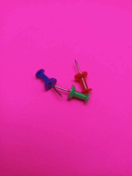 istock paper pin with isolated and pink background 1475895064