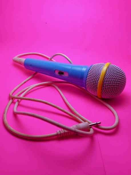 istock blue mikropgone isolated with pink background 1475895435
