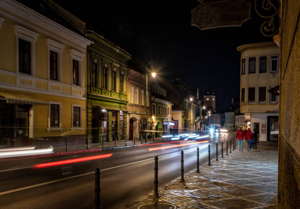 istock Road through Brasov at night 1475899358