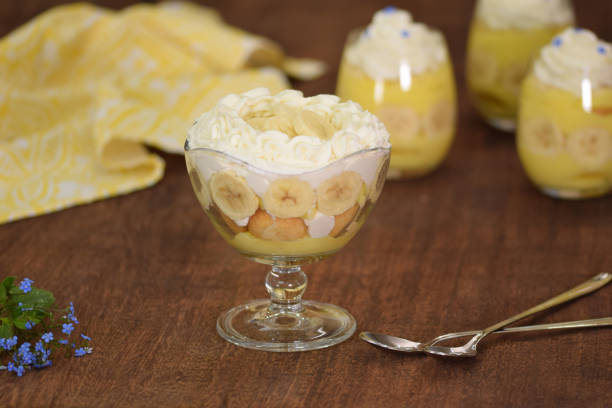 istock Glasses with delicious banana pudding on table. 1475899617