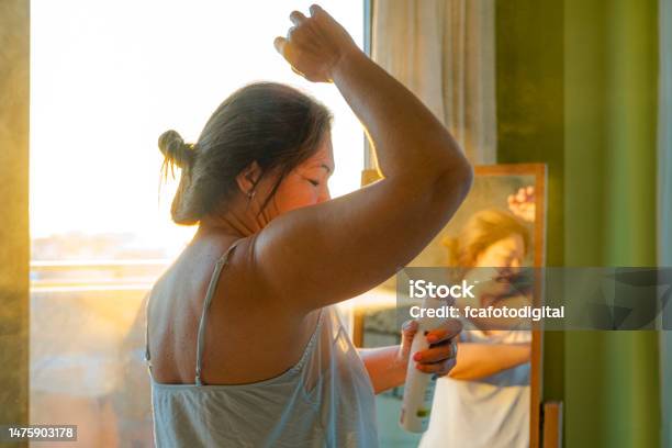 Woman Applying Deodorant On Underarm Stock Photo - Download Image Now - Deodorant, Women, Armpit