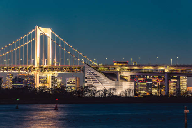 istock Rainbow Bridge going over Tokyo Bay in Tokyo, Japan 1475904132