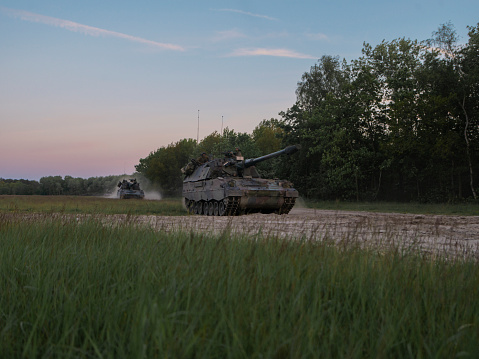 Panzerhouwitser / Panzerhaubitze / armoured howitzer / PzH 2000 NL drivingon a dirt road during exercise